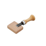 Buttonhole cutter with wooden block